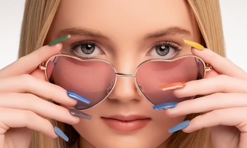 A model with glasses and iPolish fingernails