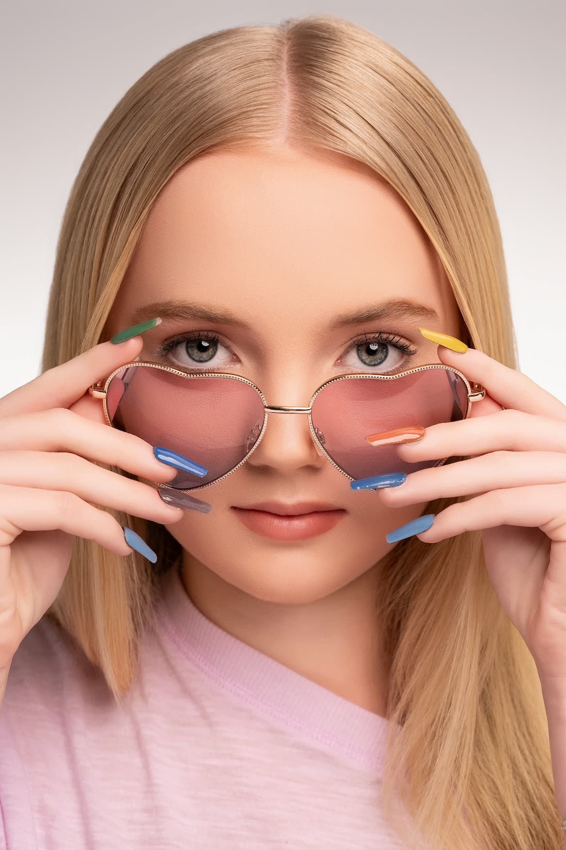 A model with glasses and iPolish fingernails